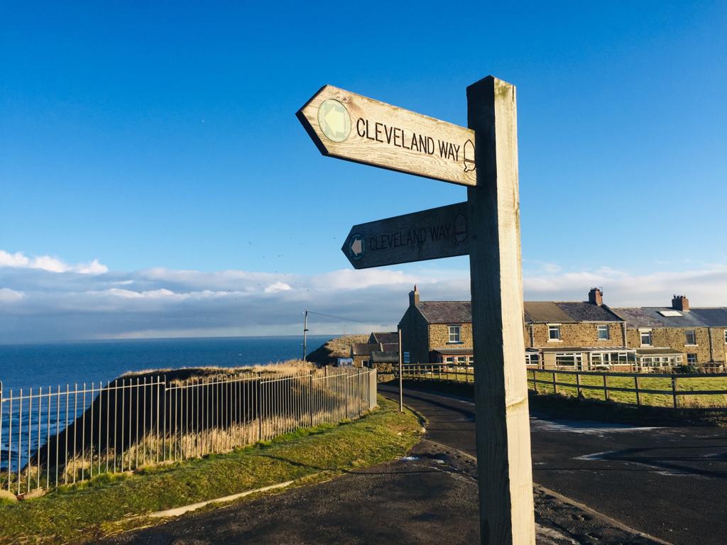 Public foothpath sign pointing to Cleveland way walk